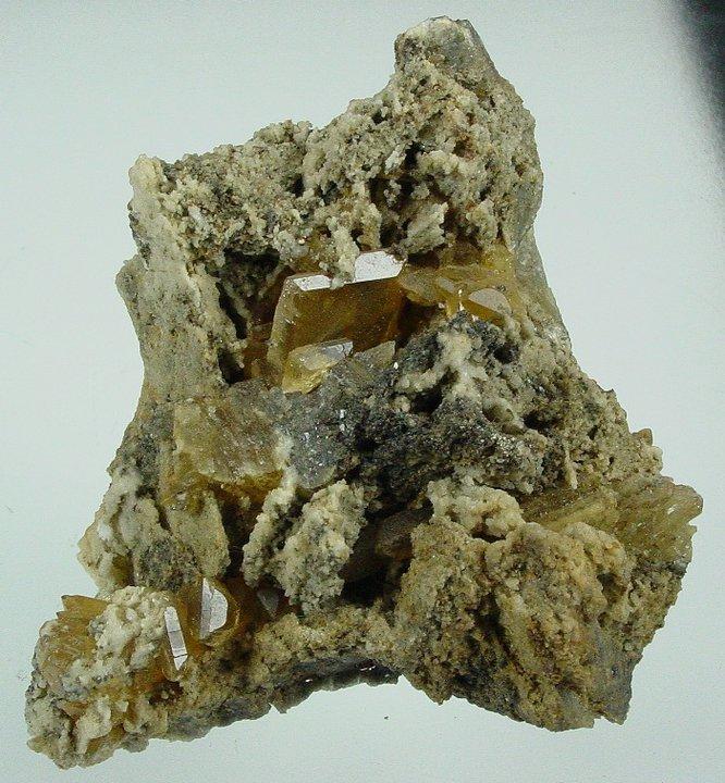 8 x 6 cm. Honey coloured tabular crystal of barite with minor galena() on dolomite. There is some damage to this piece, hence the price. The piece could be trimmed. The largest barite.jpg